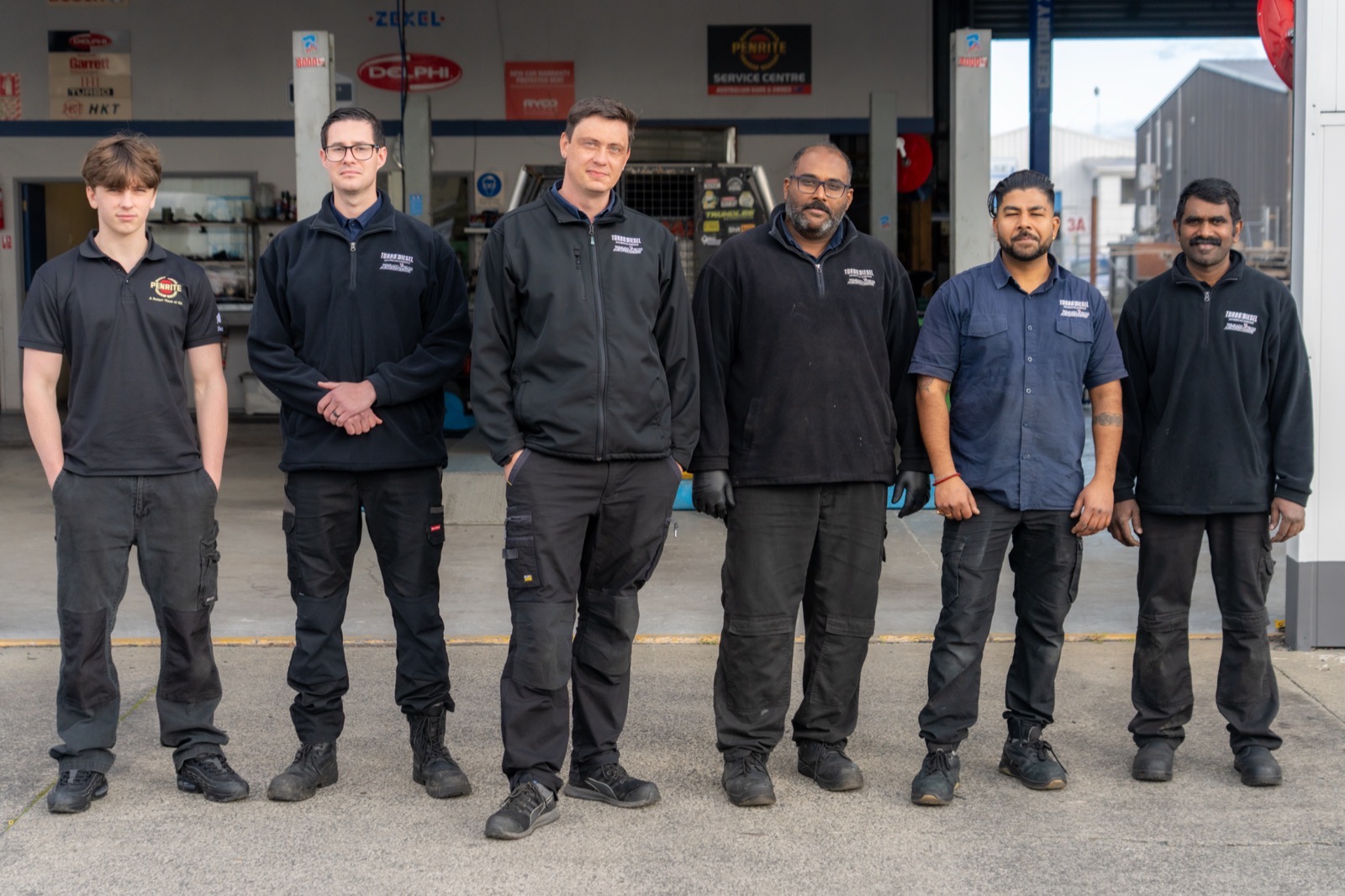 The Turbo & Diesel team at the roller-door forecourt where motorhomes and larger vehicles come in.